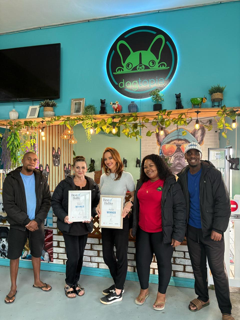 The Dogtopia Ballito team celebrating with their Best of Ballito winner's certificates