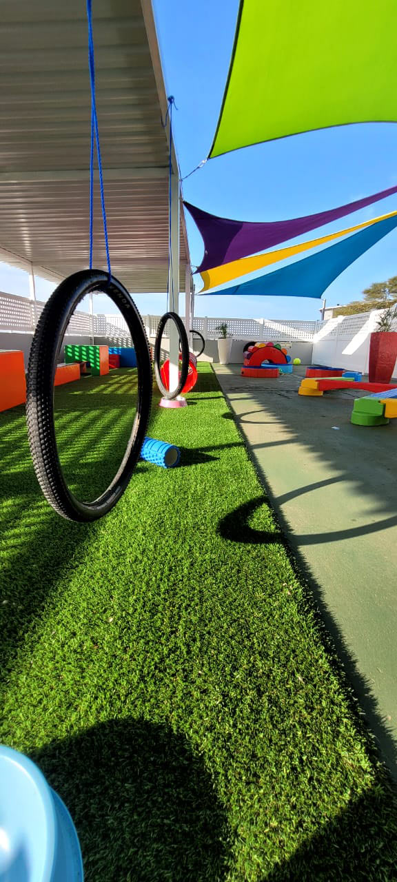 Hanging tyre-swing ring on the rooftop deck
